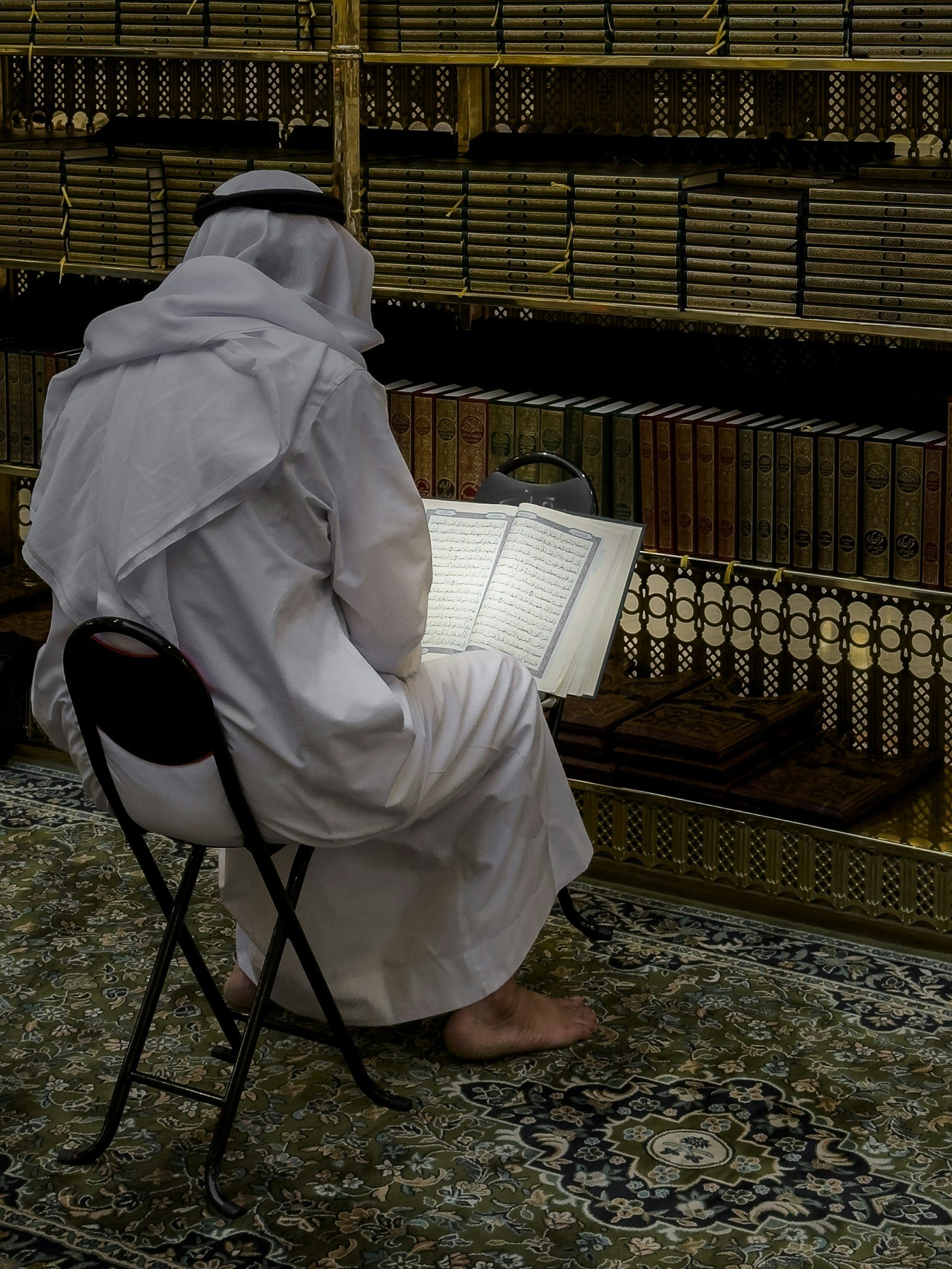 A man reciting the Qur’an in a mosque