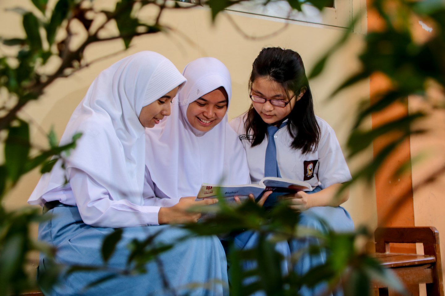 Three students learning together at school
