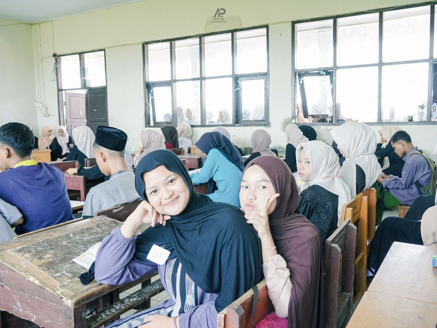 Students attending a school gathering in modest dress